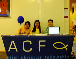 Smiling faces await at the welcome table.